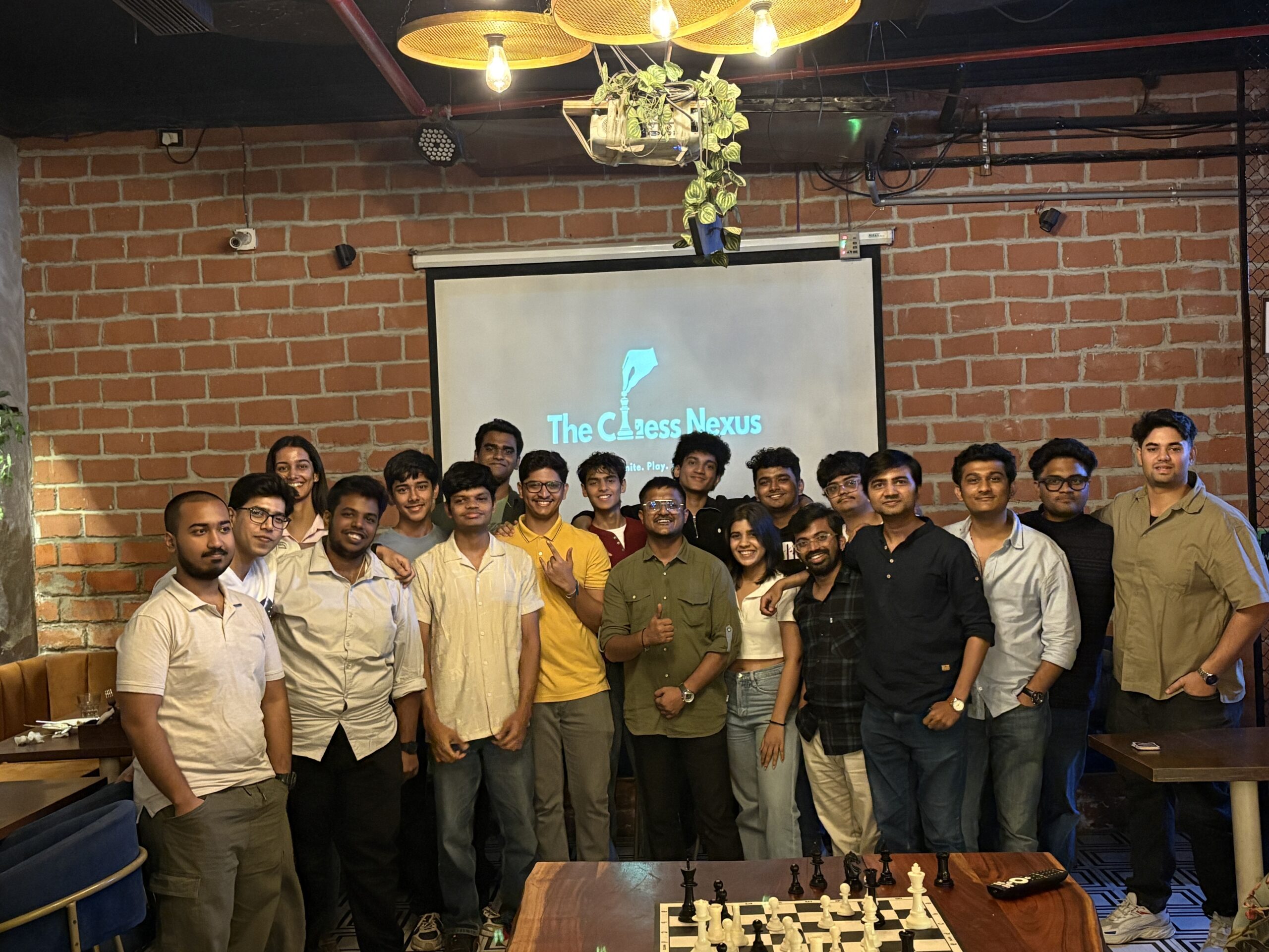 Chess Nexus atmosphere — guests gathered around the chess boards